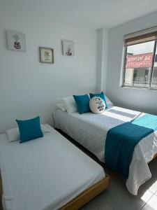 Postel nebo postele na pokoji v ubytování 203 Apartamento Frente al Mar