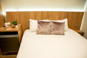 Uma cama ou camas num quarto em SkyHub