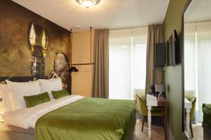 Postel nebo postele na pokoji v ubytování The Muse Amsterdam - Boutique Hotel