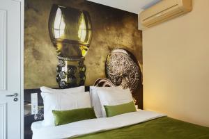 Postel nebo postele na pokoji v ubytování The Muse Amsterdam - Boutique Hotel