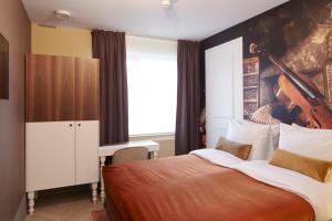 Postel nebo postele na pokoji v ubytování The Muse Amsterdam - Boutique Hotel