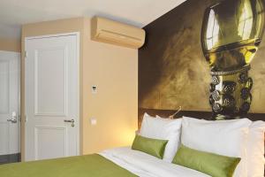 Postel nebo postele na pokoji v ubytování The Muse Amsterdam - Boutique Hotel