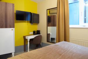 TV a/nebo společenská místnost v ubytování The Muse Amsterdam - Boutique Hotel