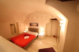 מיטה או מיטות בחדר ב-Il Porto Di Ciccia'