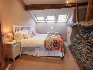 Ένα ή περισσότερα κρεβάτια σε δωμάτιο στο Jacky Garth Cottage