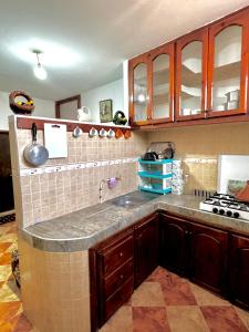 Kuchyň nebo kuchyňský kout v ubytování Appartement confort et sérénité
