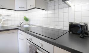 Kuchyň nebo kuchyňský kout v ubytování Helles Apartment nähe Uni-Klinik mit Super Lage - W-Lan - Balkon in den Innenhof