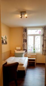 Postel nebo postele na pokoji v ubytování Hotel Pflug