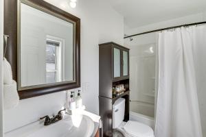 a bathroom with a sink and a toilet and a mirror at Entire Private Home 2BR 2BTH Quite Area with parking in Lynn +22 photos