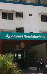 a building with a sign that reads part hotel marinas at Apart Hotel Marinas Tamandaré in Tamandaré