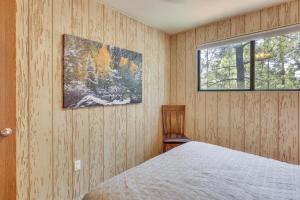 a bedroom with a bed and a window at Cozy Cabin in Greer Hike, Bike and Ski! in Greer
