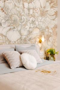 Voodi või voodid majutusasutuse Domus Carmeli Chic Appartments Powiśle toas