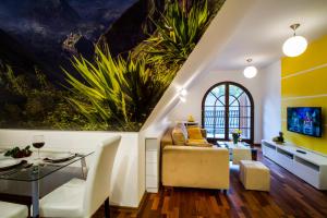 a living room with a couch and a table at Katmandu in Zakopane