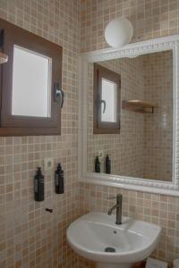 a bathroom with a sink and a mirror at Hostal La Torre Ibiza Cap Negret in San Antonio