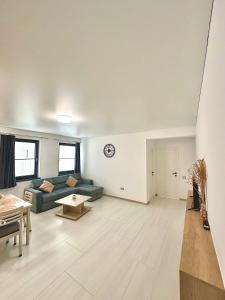 a living room with a couch and a table at B2 Boutique Apartments in Năvodari