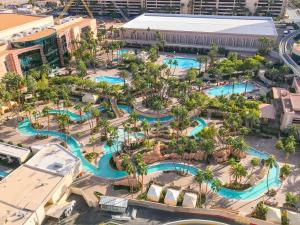 an aerial view of a water park at a resort at No Resort Fee Strip View Suite +Free Valet + Pool in Las Vegas