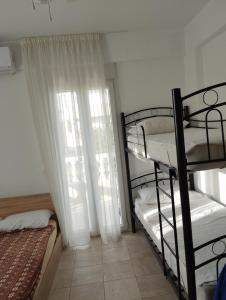 Postel nebo postele na pokoji v ubytování Apartment Irini