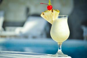 a drink with a margarita and a cherry on top at Bungalows Playa Bonita in Máncora