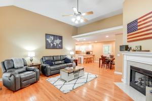 a living room with two chairs and a fireplace at Cozy Hermitage Home with Deck 11 Mi to Nashville! in Hermitage