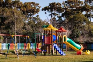 a park with a playground with a slide at Maravilhoso Studio Royal Mountain Village - 3005 in Canela