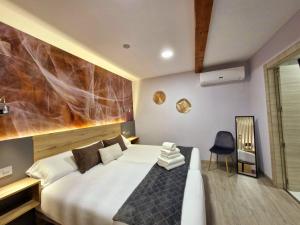 Postel nebo postele na pokoji v ubytování Feeling Home - Suites&Rooms