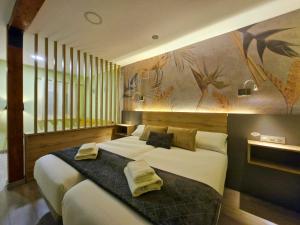 Postel nebo postele na pokoji v ubytování Feeling Home - Suites&Rooms