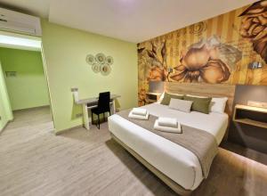 Postel nebo postele na pokoji v ubytování Feeling Home - Suites&Rooms