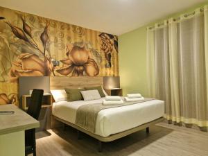 Postel nebo postele na pokoji v ubytování Feeling Home - Suites&Rooms
