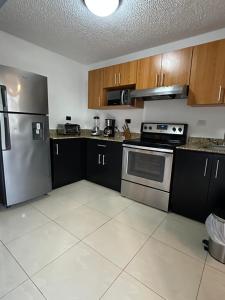 Kuchyň nebo kuchyňský kout v ubytování Jaco Beach Penthouse