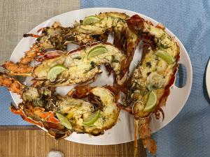 a plate of food with shrimp on a table at Casa Mano Juan in Mano Juan