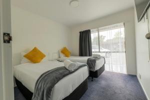 Postel nebo postele na pokoji v ubytování Marton Motel NZ