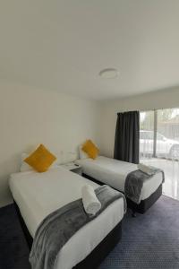 Postel nebo postele na pokoji v ubytování Marton Motel NZ
