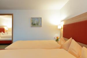 Postel nebo postele na pokoji v ubytování Hotel Haflhof