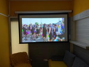 a tv screen with a group of people on it at residence caramboles in Fort-de-France +116 photos