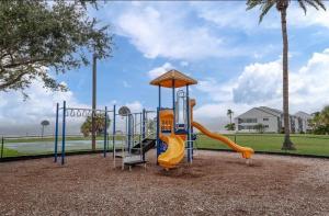 a playground with a slide in a park at Little Harbor Resort #301 Tampa Bay FL Beach, Nautical Paradise in Ruskin