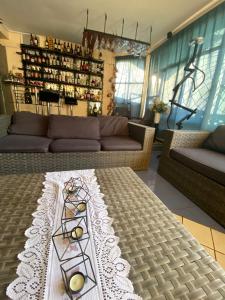 a living room with a couch and a table at Amplia casa con piscina y vista al mar in Cartagena