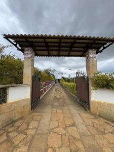 a bridge over a walk way with a fence at Casa Guanentina - Habitaciones familiares in Villanueva