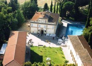an aerial view of a large house with a pool at Hotel Villa San Donino in Città di Castello