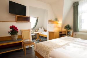 Postel nebo postele na pokoji v ubytování Hotel Heinz