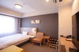 TV a/nebo společenská místnost v ubytování Shinrin Hotel