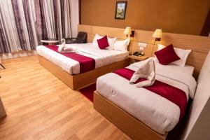 Letto o letti in una camera di Hotel Ananda Inn