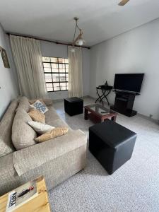 Μια τηλεόραση ή/και κέντρο ψυχαγωγίας στο Apartamento con una terraza muy espaciosa