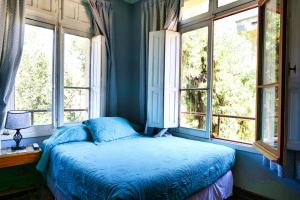 Cama ou camas em um quarto em Hostal Boonen