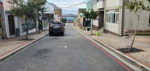 a truck parked on the side of a street at No8@Mosselbay - Central Mosselbay 1 Bedroom Apartment in Mossel Bay +4 photos