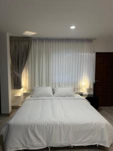 Postel nebo postele na pokoji v ubytování Hotel Nanon Sathorn