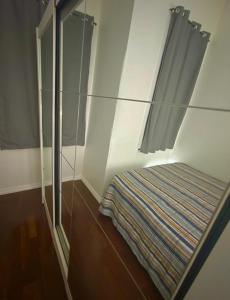 Ένα ή περισσότερα κρεβάτια σε δωμάτιο στο Quarto Em Laranjeiras