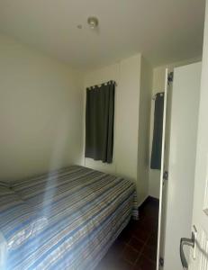 Ένα ή περισσότερα κρεβάτια σε δωμάτιο στο Quarto Em Laranjeiras