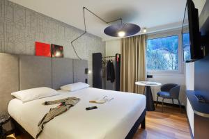 Postel nebo postele na pokoji v ubytování Ibis Sallanches Porte du MontBlanc