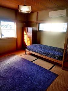 Postel nebo postele na pokoji v ubytování 海っぺりー大網白里