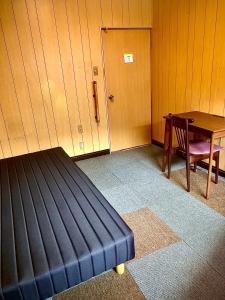 Postel nebo postele na pokoji v ubytování 海っぺりー大網白里